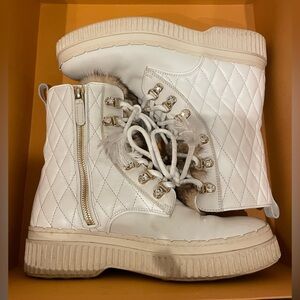 Tod's ankle boots adorned with Swarovski crystals and mink fur.